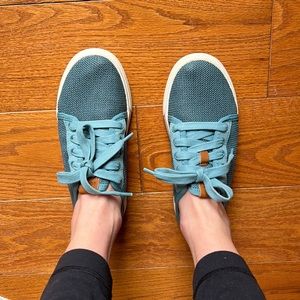 OluKai Women’s Pehuea Lī Lightweight Sneaker in Teal Blue.